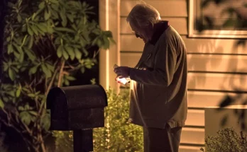 An older man near a mailbox at night | Source: AmoMama