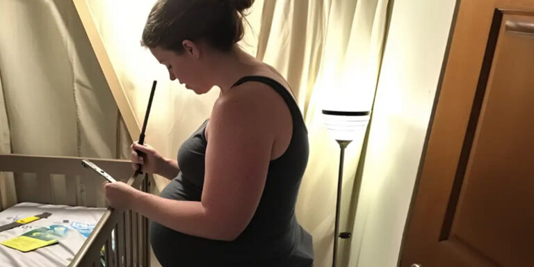 A pregnant woman assembling a crib | Source: Amomama