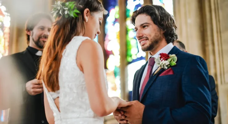 A couple at the altar | Source: Shutterstock