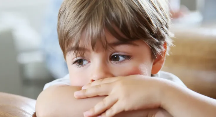 A little boy with folded arms | Source: Shutterstock