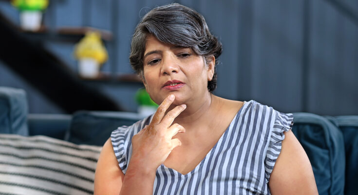 A woman with a thoughtful look | Source: Shutterstock