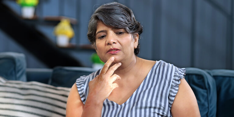 A woman with a thoughtful look | Source: Shutterstock