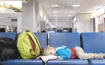 Little Boy Sleeping On Seats At an Airport. | Source: Shutterstock