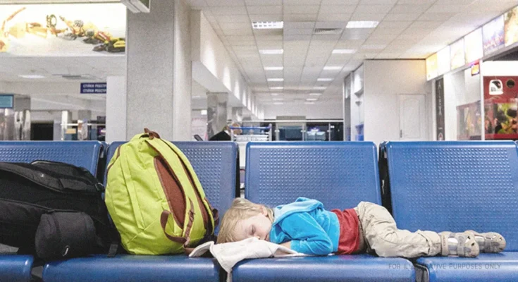 Little Boy Sleeping On Seats At an Airport. | Source: Shutterstock