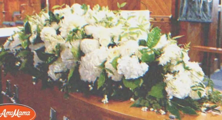 A coffin with flower on top of it | Source: Shutterstock