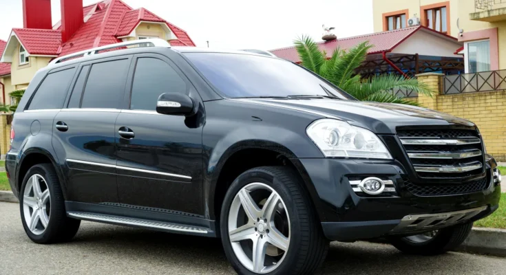 A black SUV parked on a suburban street | Source: Shutterstock