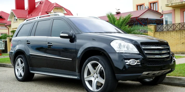 A black SUV parked on a suburban street | Source: Shutterstock