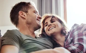 A husband and wife laughing | Source: Shutterstock