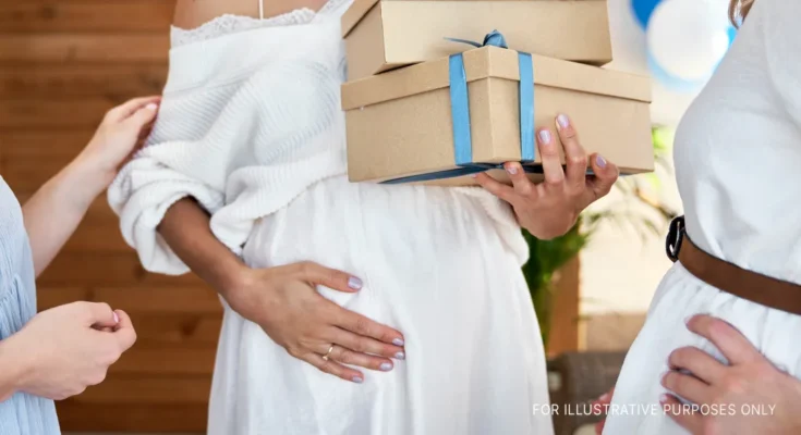 A pregnant woman holding her belly | Source: Shutterstock