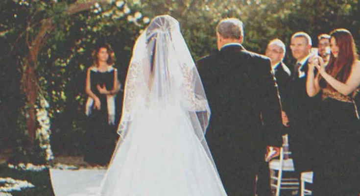 A man walking a bride down the aisle for her wedding | Source: Shutterstock