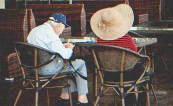 A couple of elders sitting in a restaurant | Source: Shutterstock