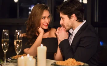 A couple sitting at a restaurant | Source: Shutterstock