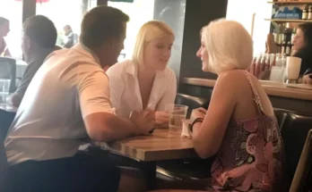 Two women and a man seated in a restaurant | Source: Amomama