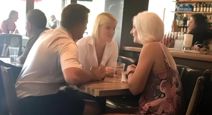 Two women and a man seated in a restaurant | Source: Amomama