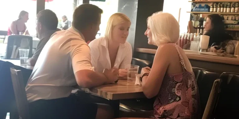 Two women and a man seated in a restaurant | Source: Amomama