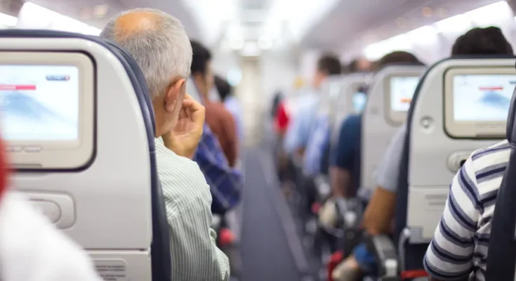 Passengers in an airplane | Source: Shutterstock