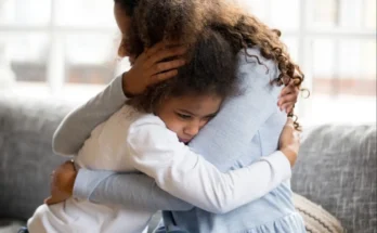 Woman hugging a child | Source: Shutterstock