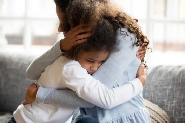 Woman hugging a child | Source: Shutterstock