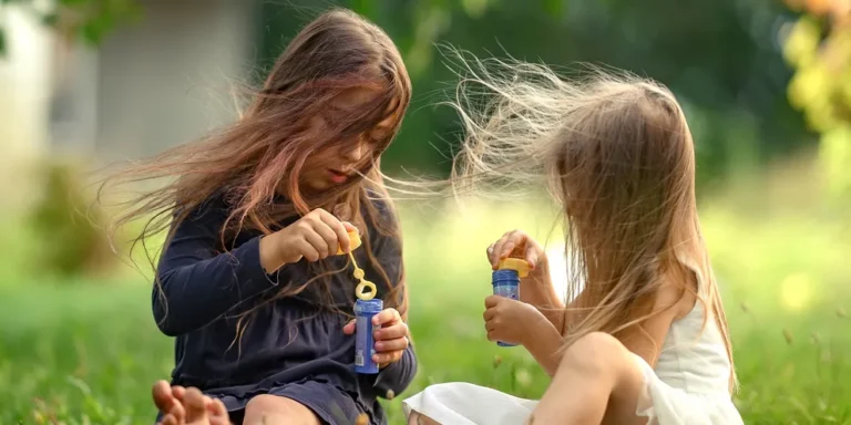 Two girls playing outside | Source: Shutterstock