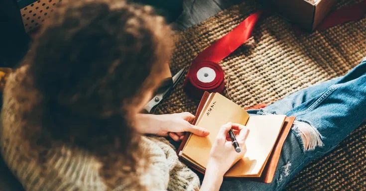 A woman making a list | Source: Shutterstock