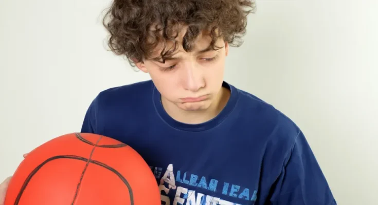 A young boy holding a basketball | Source: Amomama