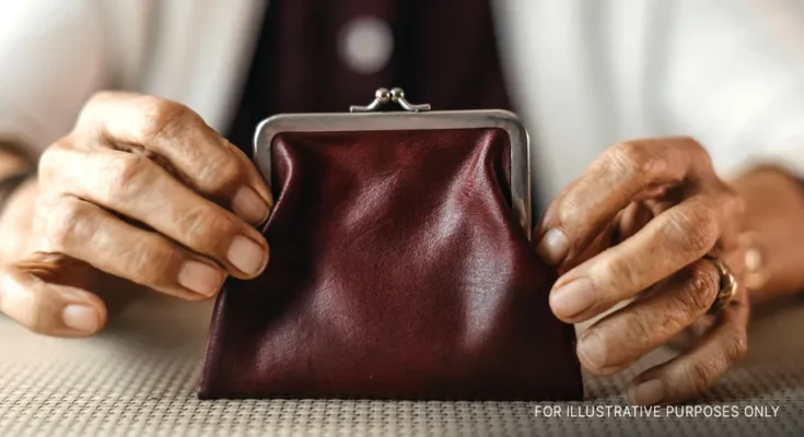 Woman holding a wallet | Source: Getty Images