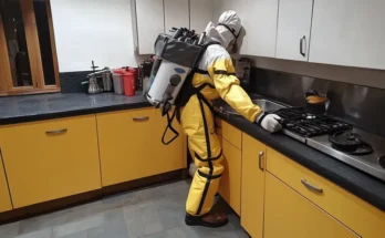 A fumigator working in the kitchen | Source: Amomama