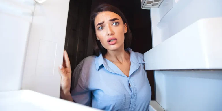 A woman looking inside a fridge | Source: Shutterstock