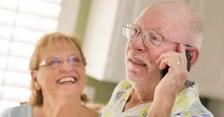 An elderly man on the phone | Source: Shutterstock