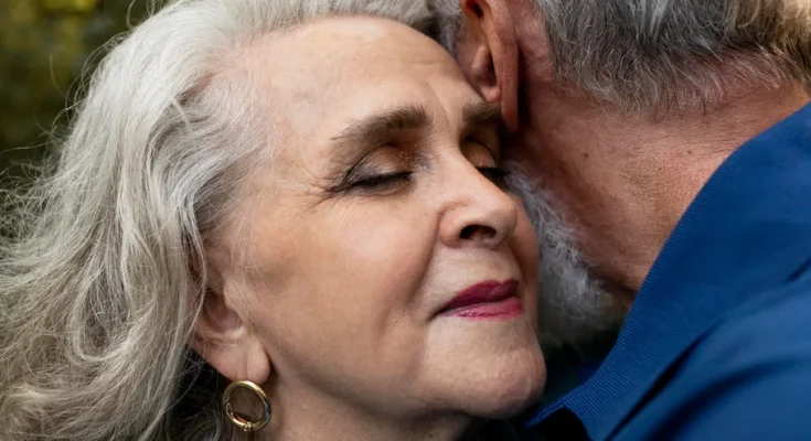 A happy elderly couple embracing | Source: Freepik