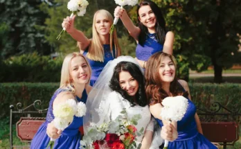 A happy bride surrounded by her bridesmaids | Source: Freepik