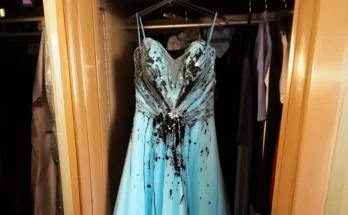 A blue dress covered in black paint | Source: Amomama