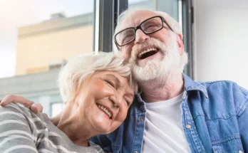 A mature couple laughing together | Source: Shutterstock