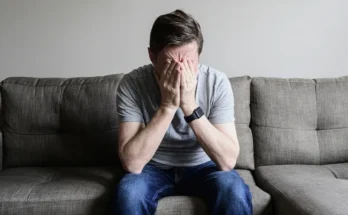 Upset man sitting on a couch | Source: Getty images