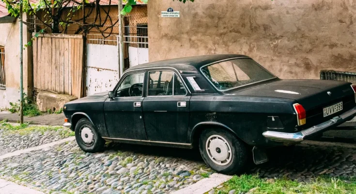 An old car parked outside | Source: Shutterstock