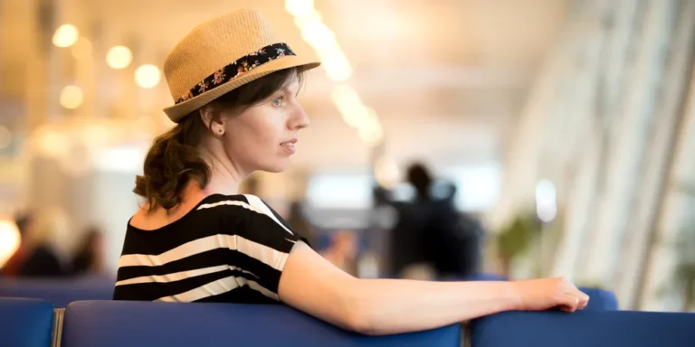 A woman sitting at the airport | Source: Shutterstock