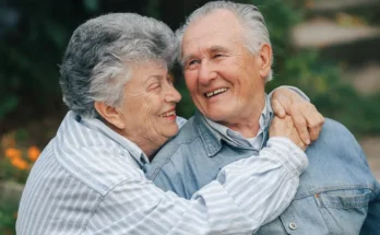 An elderly couple laughing | Source: Freepik