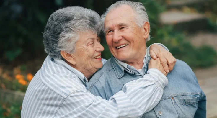 An elderly couple laughing | Source: Freepik