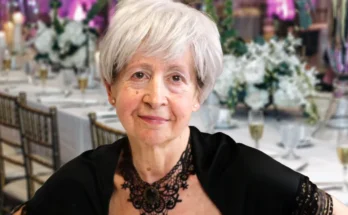 An older woman in a black dress | Source: Shutterstock