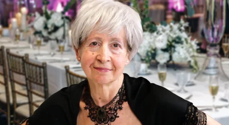 An older woman in a black dress | Source: Shutterstock