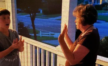 A woman and a boy talking on a porch | Source: AmoMama