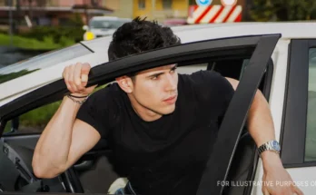 Young man exiting car | Source: Shutterstock