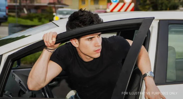 Young man exiting car | Source: Shutterstock