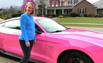 A woman standing beside a pink car | Source: Amomama