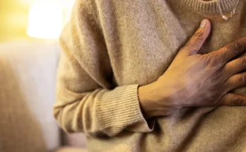 A person with a hand on their chest | Getty Images