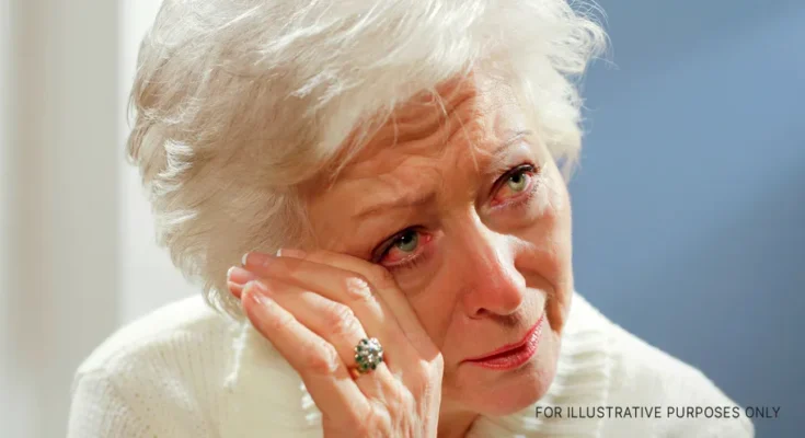 An elderly woman wiping away tears | Source: Getty Images