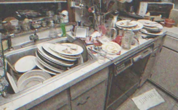 Sink overflowing with dirty dishes in the kitchen | Source: Shutterstock