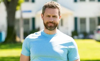 A man standing in front of a house | Source: Shutterstock