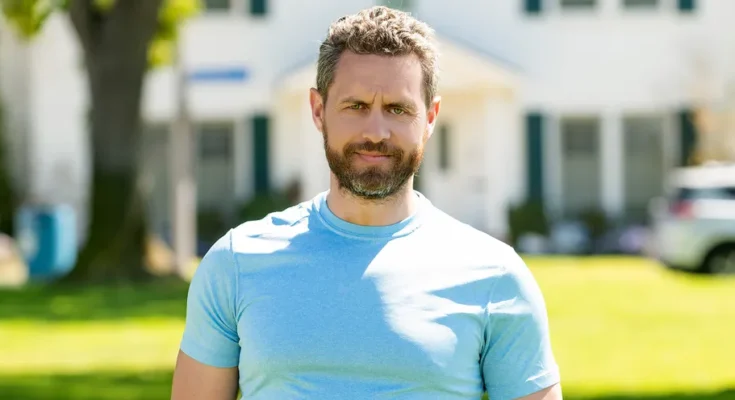 A man standing in front of a house | Source: Shutterstock