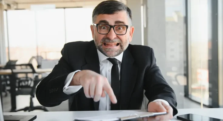 An angry boss in his office | Source: Shutterstock